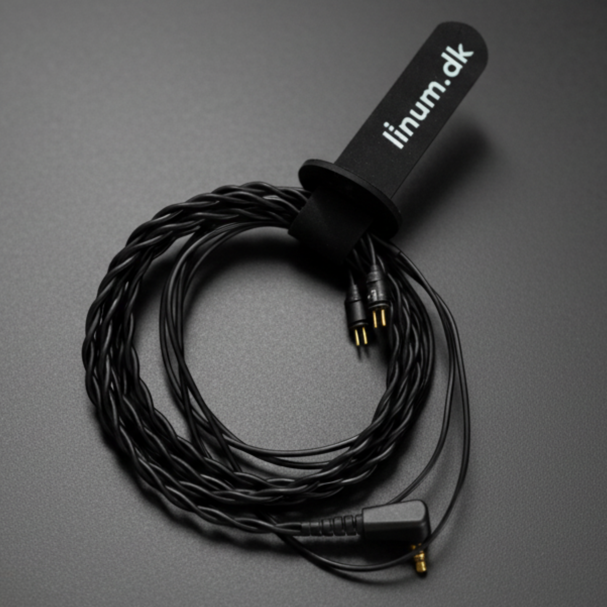 Black Linum IEM cable coiled into circle.