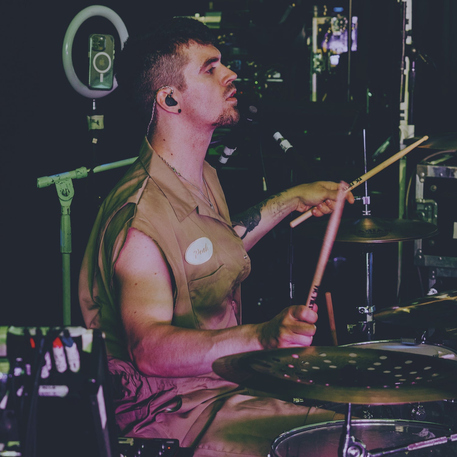 Carter Peak playing the drums wearing Plunge Audio IEMs.