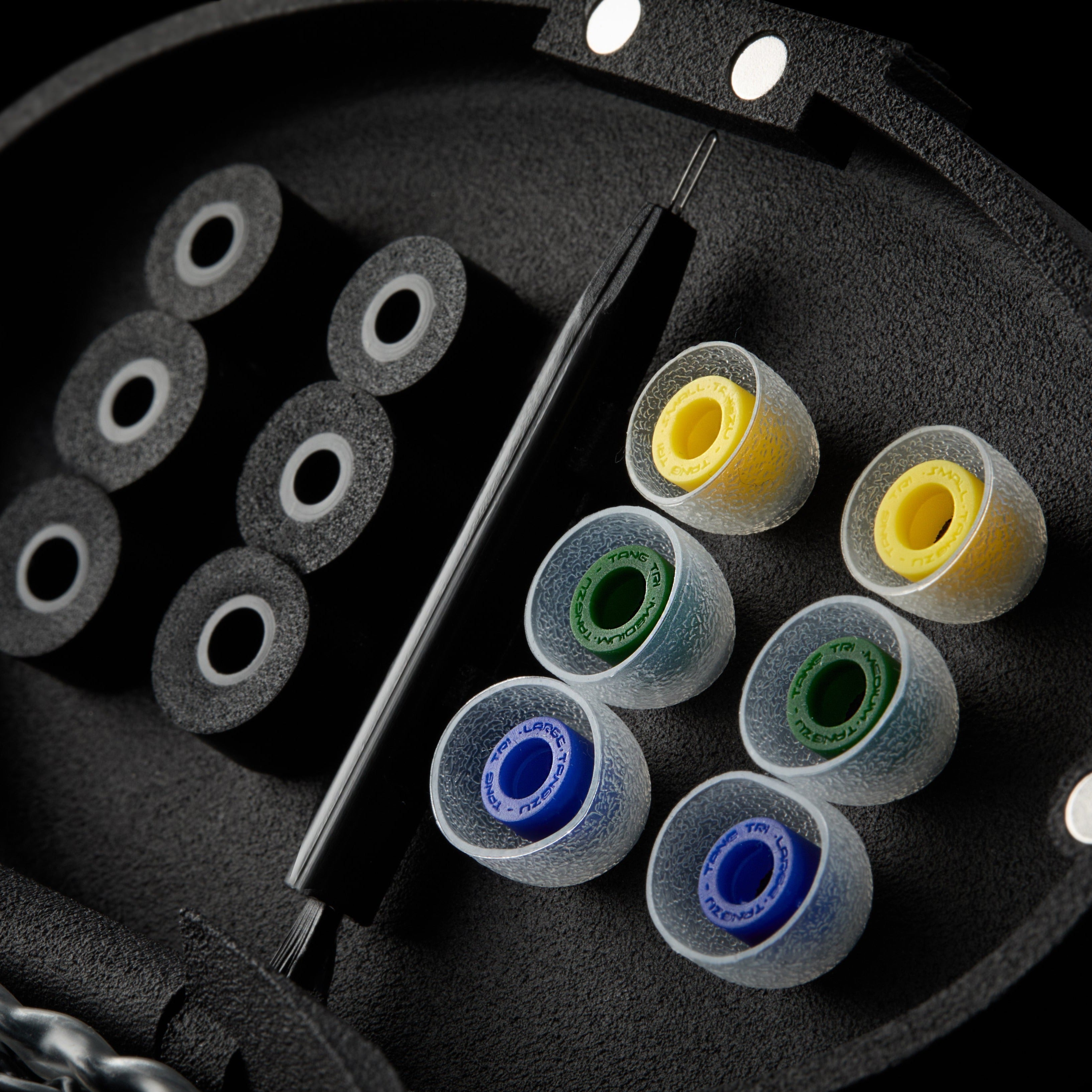 Black case with assorted colourful tips.