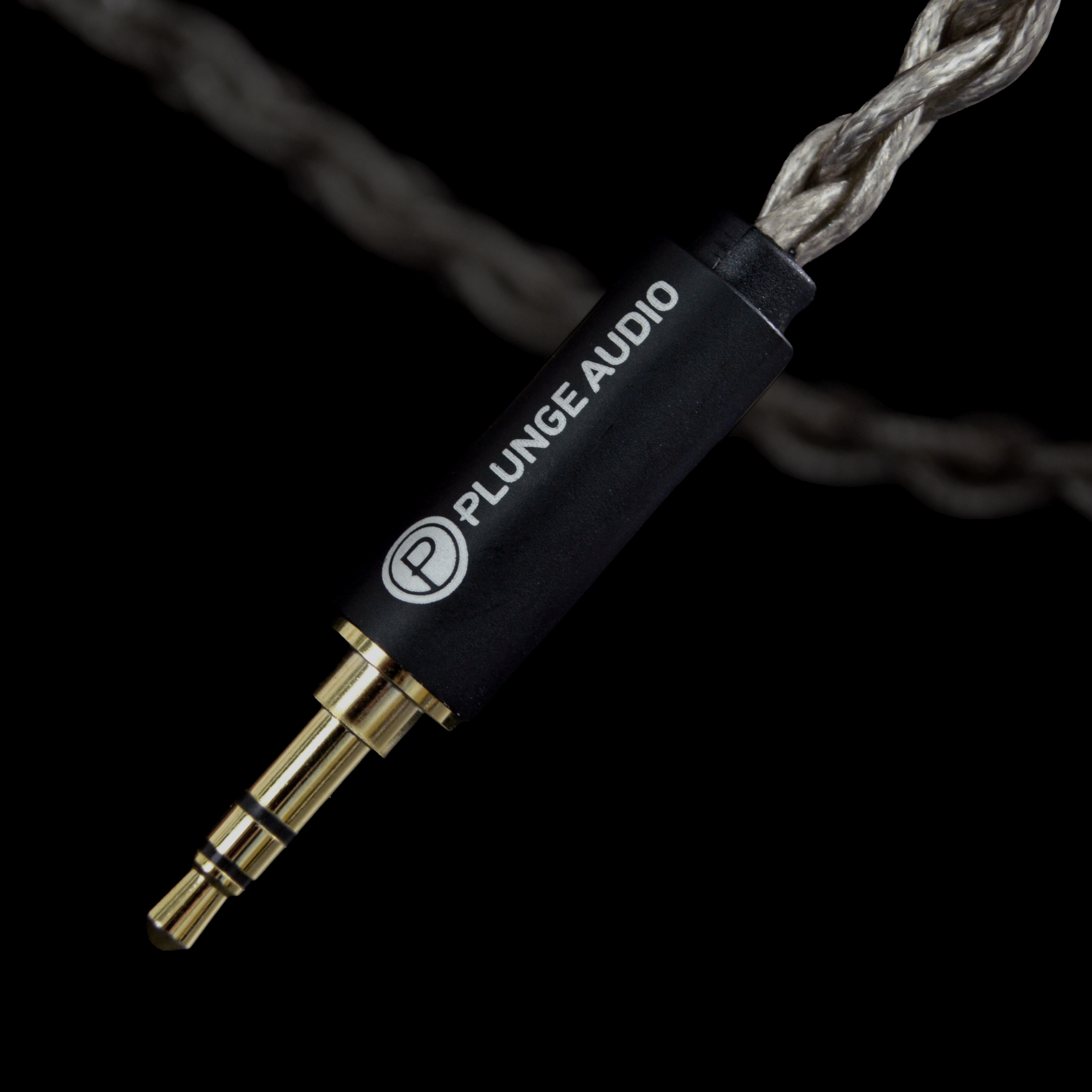 Plunge Audio audio cable connector on a black background