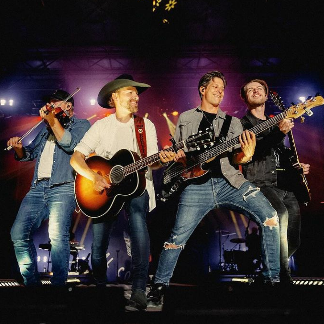 Group of musicians playing instruments on stage.