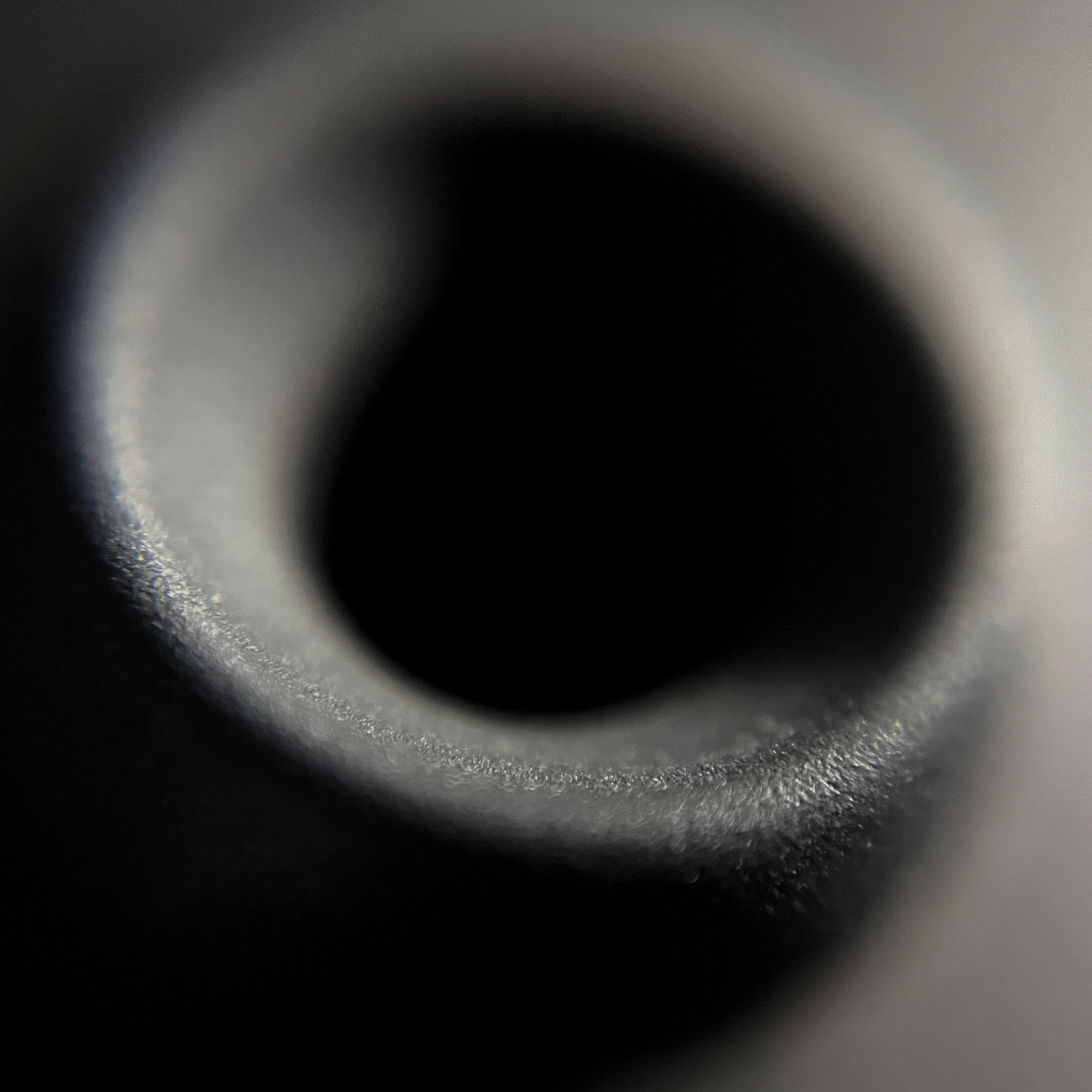 Close-up of a black hole with a dark background