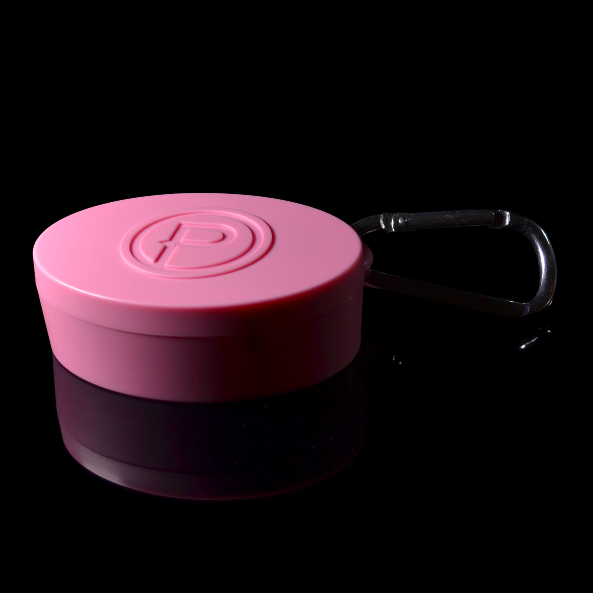 A pink oval hard IEM case featuring an embossed letter 'P' logo, attached to a silver carabiner, shown on a reflective black background.