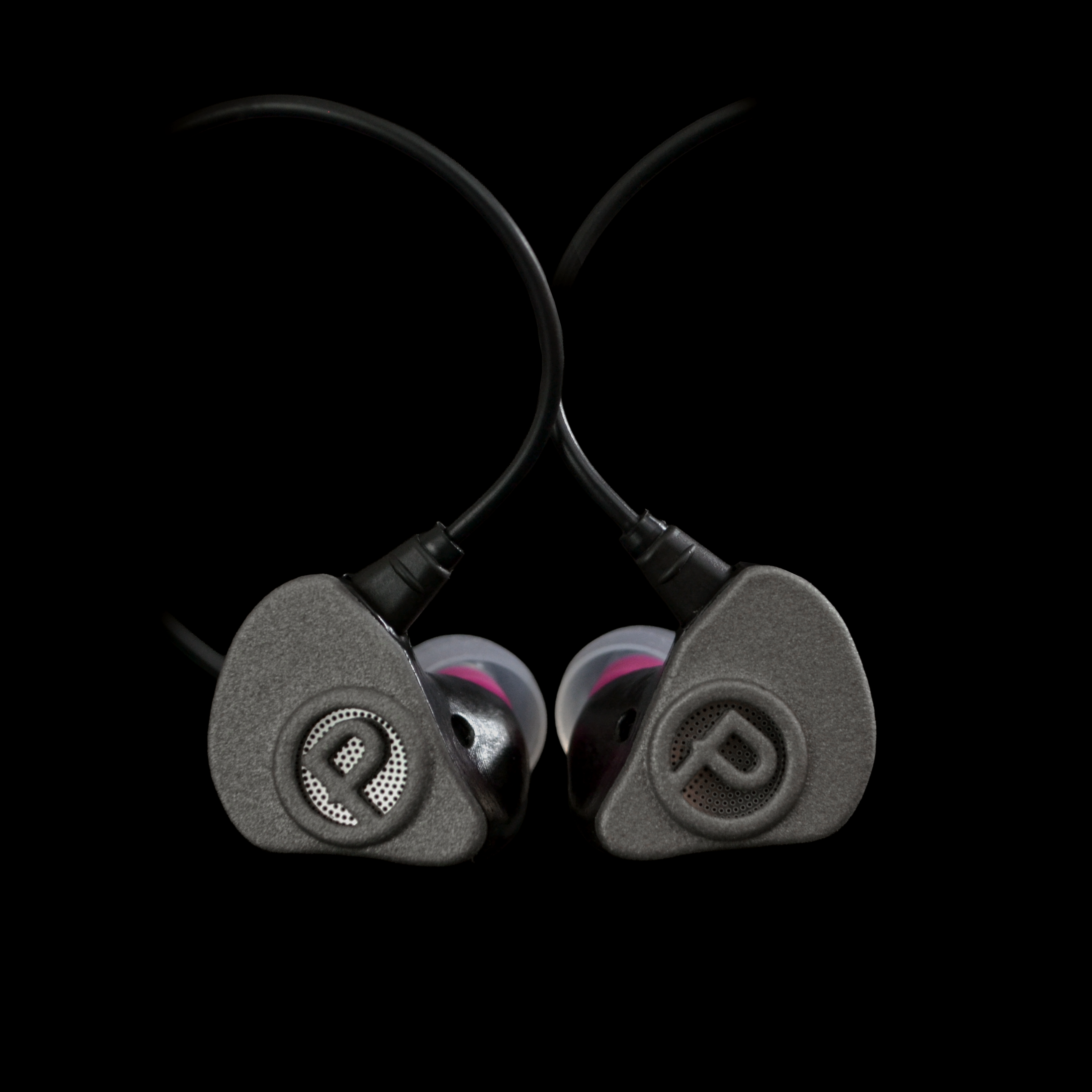 Pair of in-ear monitors on a black background