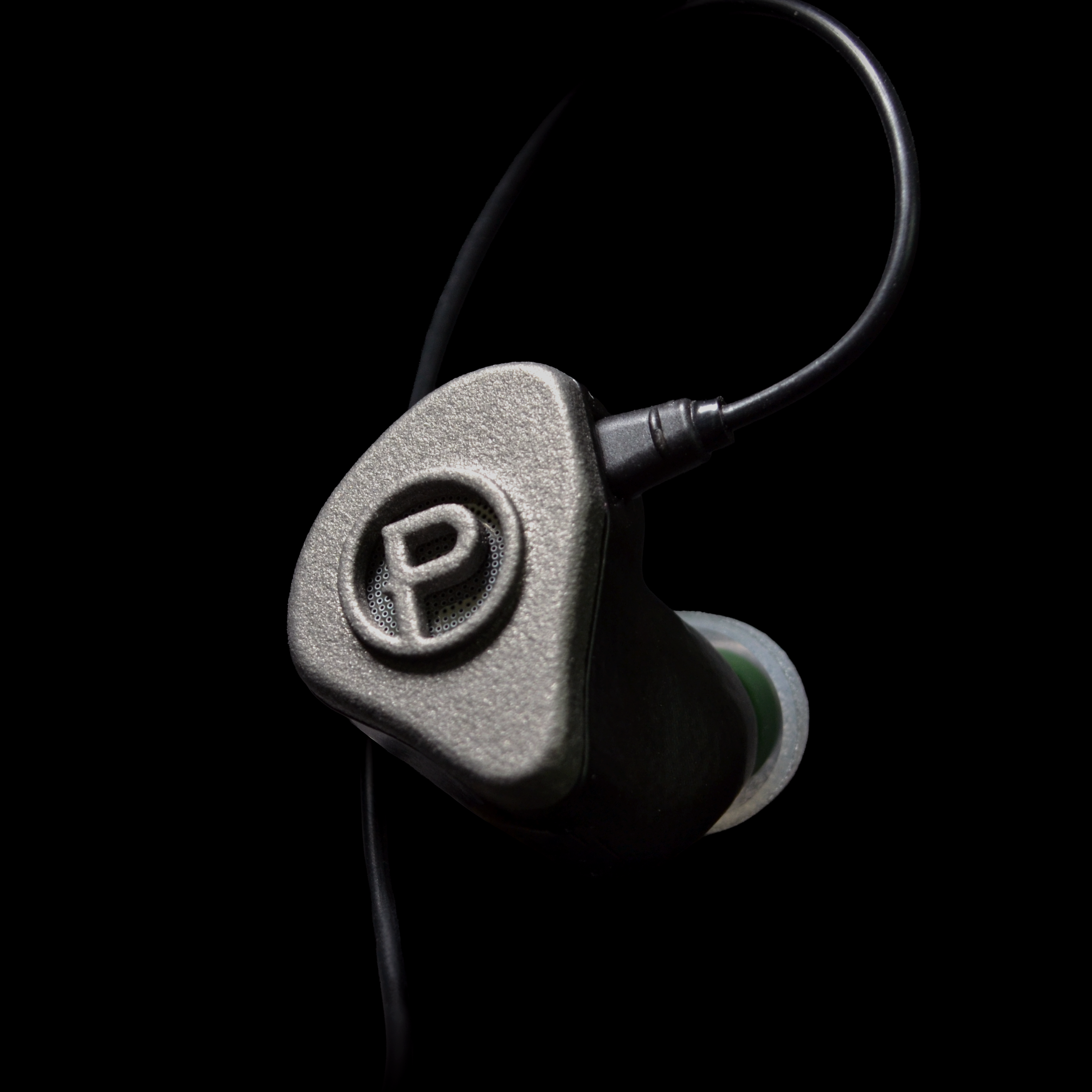 In-ear monitor with P brand logo on a black background