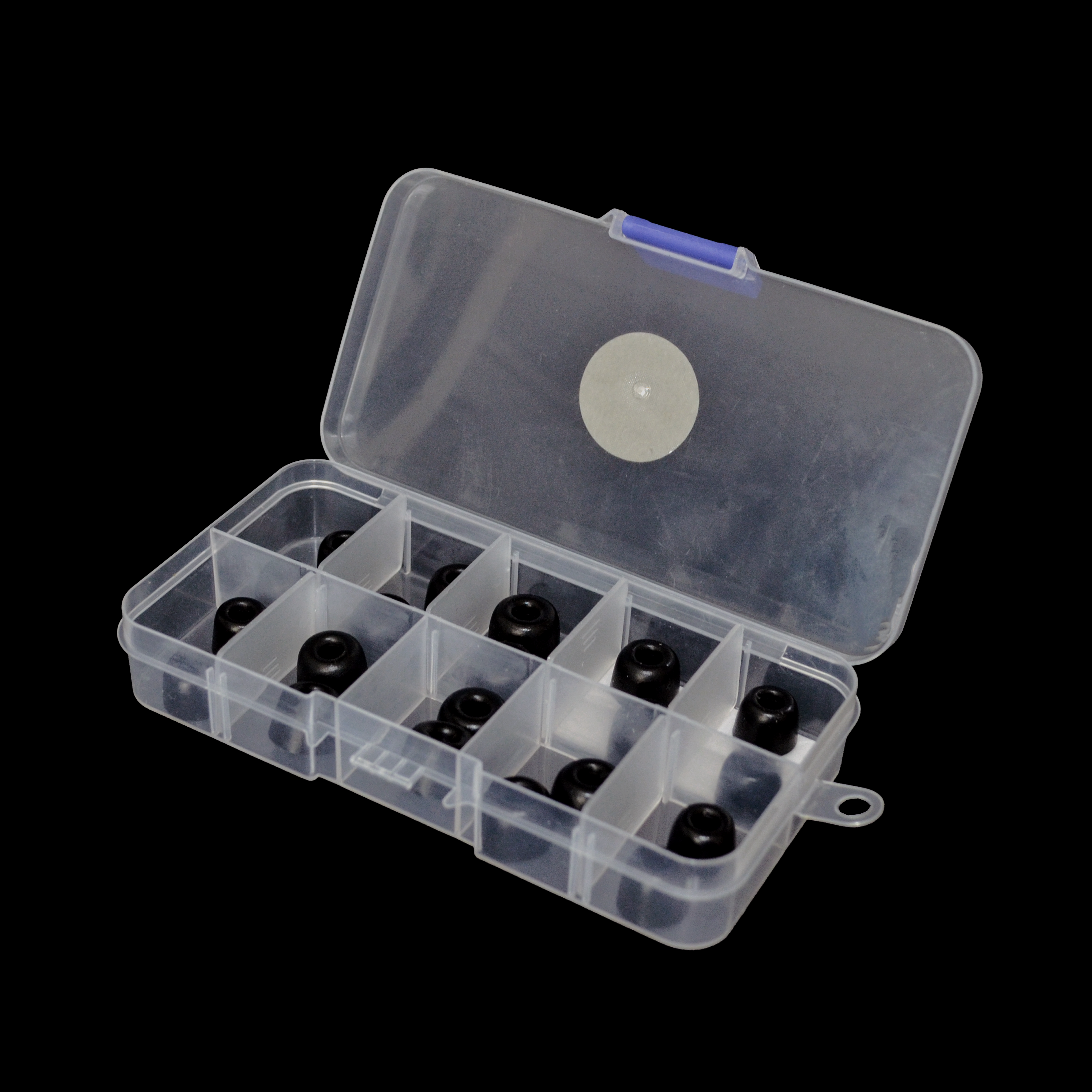 Clear plastic box with black IEM tips on a black background