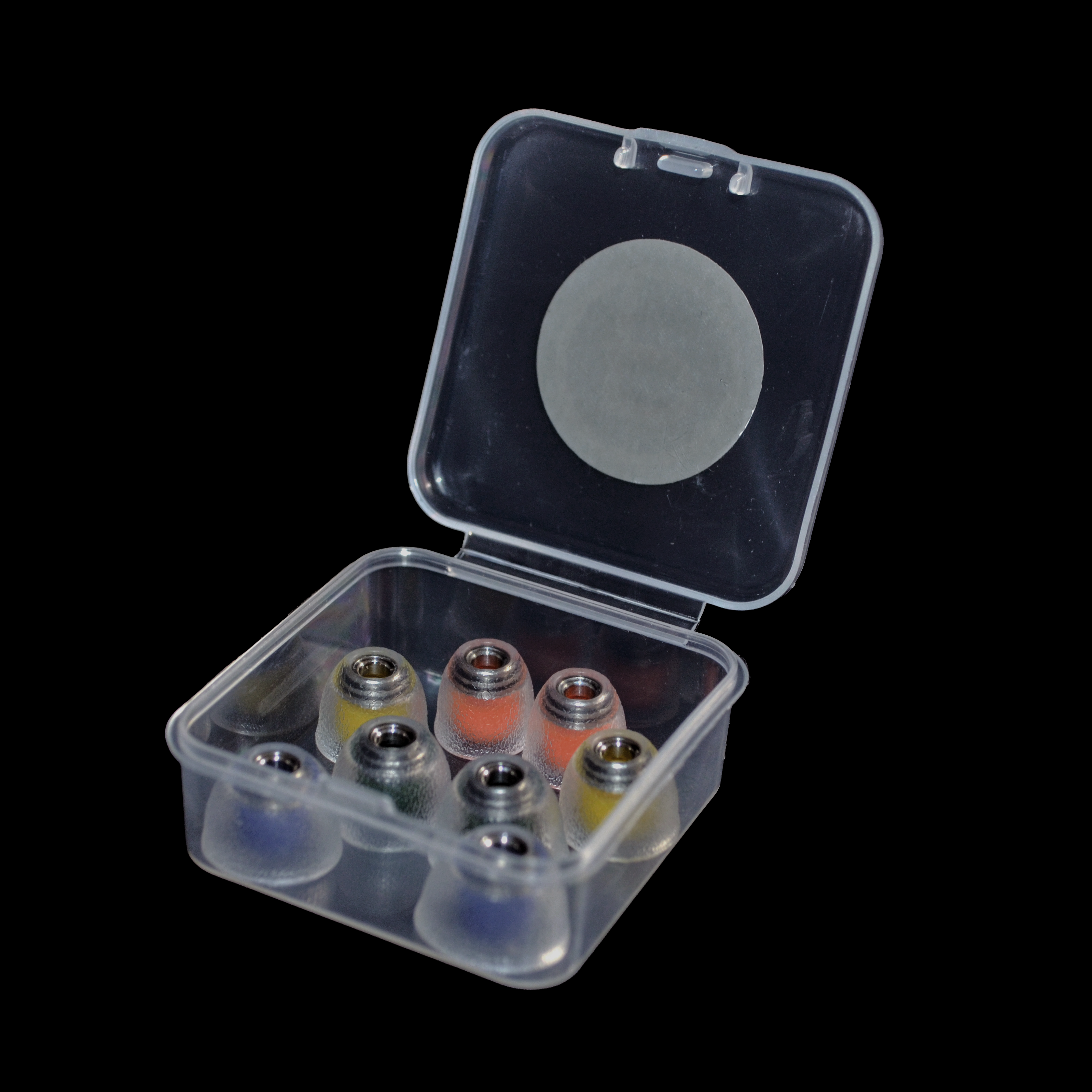 Clear plastic container with colourful IEM tips on a black background